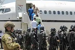 Members of the Tren de Aragua boarding the plane heading to Venezuela