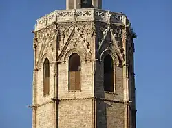 View of the top of the tower with the windows through which the bells ring
