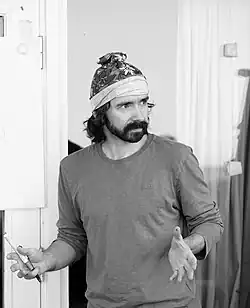 Photo of Siarhei Besarab speaking at the Vialiki Voz Conference in Pärnumaa, Estonia, illustrating his role as a public science communicator and civil activist