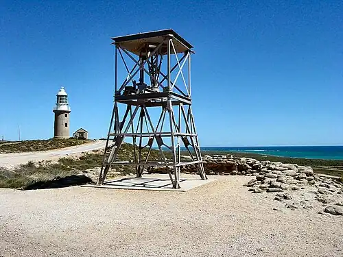 An old WWII radar tower with the Vlamingh Head Lighthouse behind