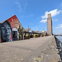 Waterfront at Woodside, Birkenhead showing Glenda Jackson mural and Queensway Tunnel ventilation shaft