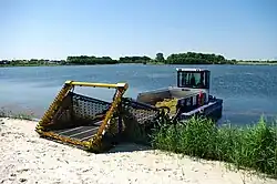 The conveyor belt on this weed harvester from the German manufacturer Berky transports the aquatic plants on its hold after cutting them