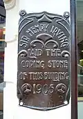 Plaque commemorating the coping stone laid by Henry Irving in 1905