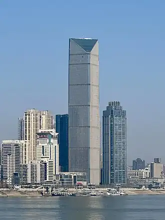 A skyscraper in shape of a rectangular Prism with two vetexes un opposite sides being higher than the 2 others