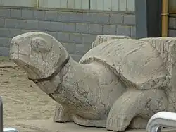 A stele-bearing turtle; tomb of Xiao Xiu