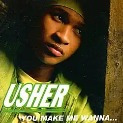 Usher leaning against a wall behind the song's title